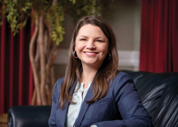 Photo of woman smiling on couch
