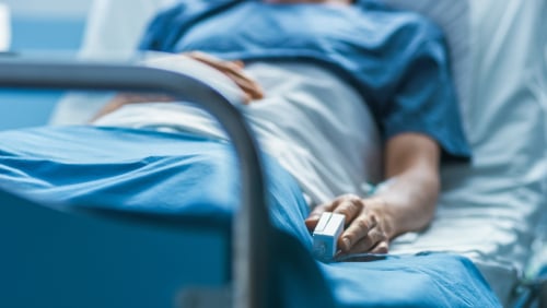 person laying in hospital bed