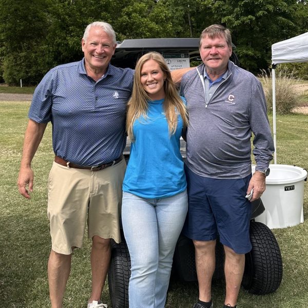 Image of blonde woman and two older gentlemen